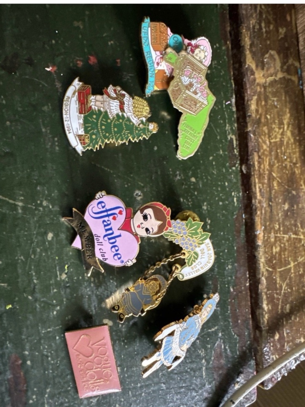 Collection of 7 Vintage PinBack Enameled Doll Club Metal Pins